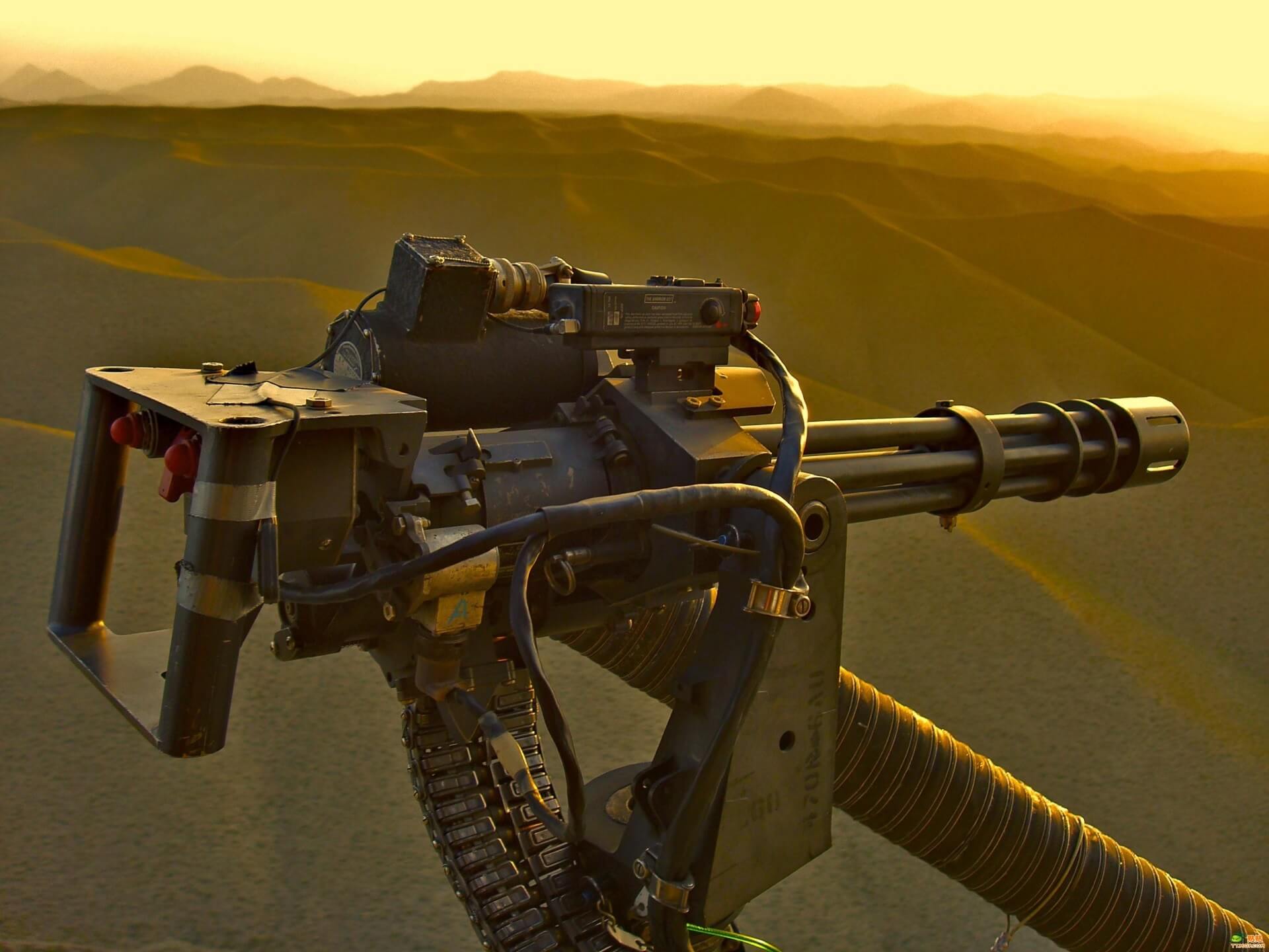 Crew-served weapon system mounted on aerial platform at sunset