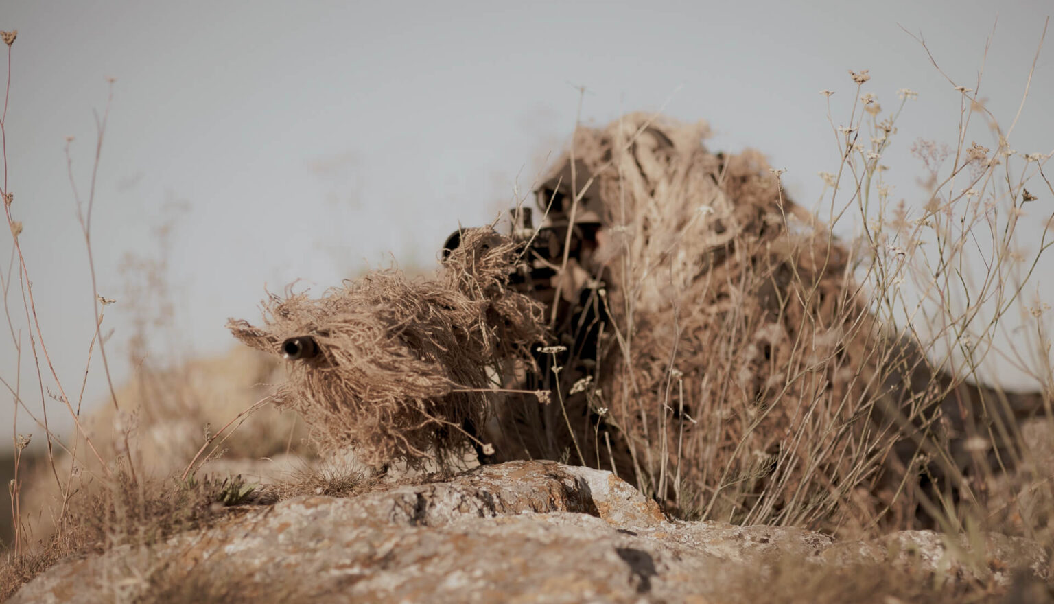 Sniper team in ghillie concealment during training exercise